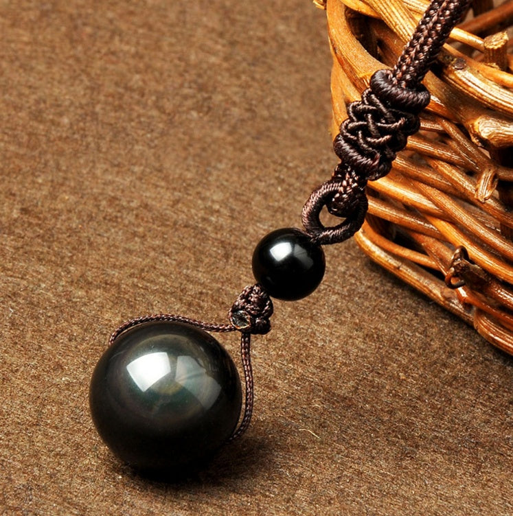 Obsidian celestial eye necklace bead detail