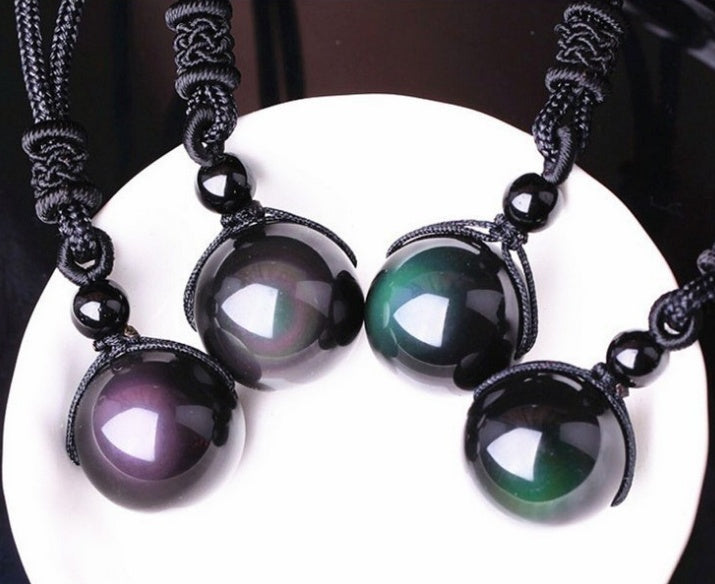 Obsidian protection stone necklace shown worn